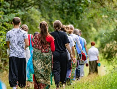 Devotees walking in a procession through the countryside